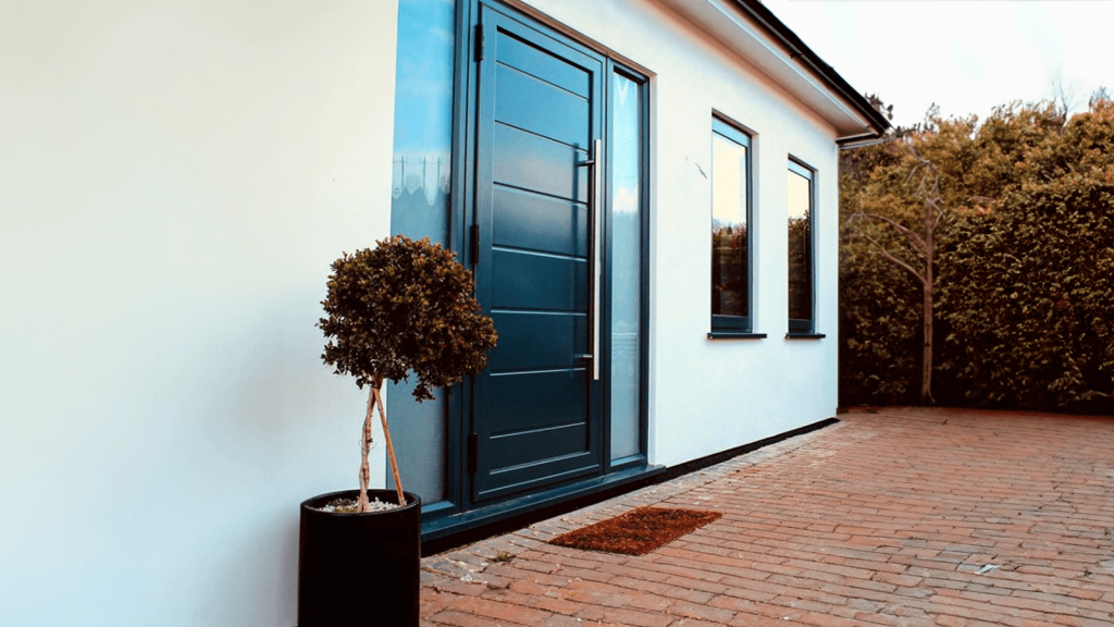 black composite door on a white home