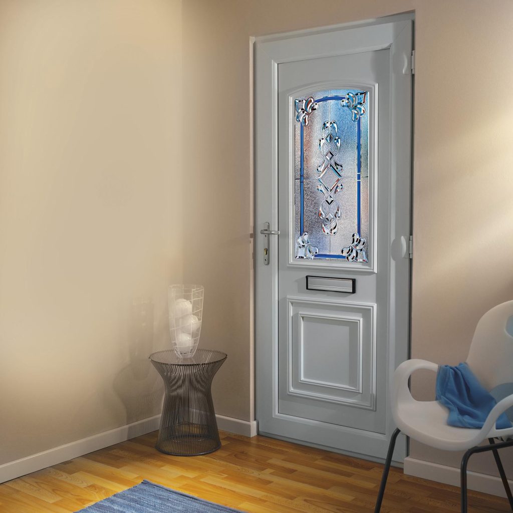 White Hurst uPVC entrance door with decorative glass panel, fitted in a modern home interior.