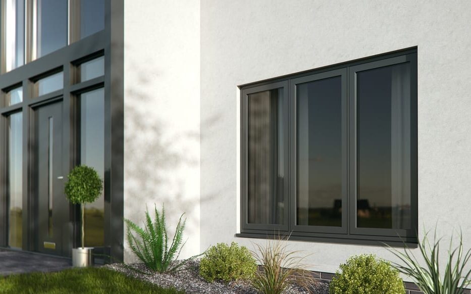 Black Kommerling flush sash window on a white house